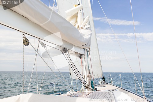 Image of close up of sailboat mast or yacht sailing on sea