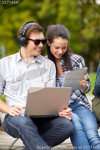 Image of students or teenagers with laptop computers