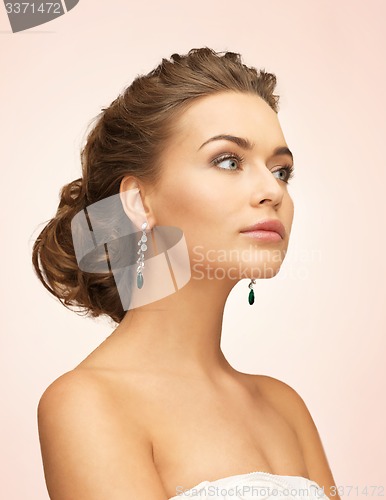 Image of woman with diamond earrings