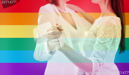 Image of close up of happy married lesbian couple dancing