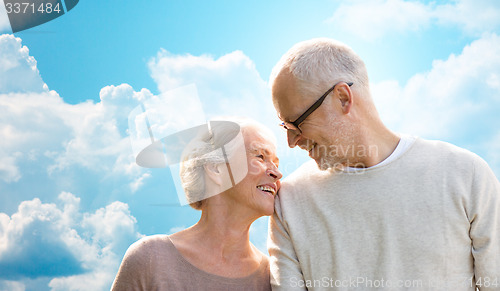 Image of happy senior couple over blue sky and clouds