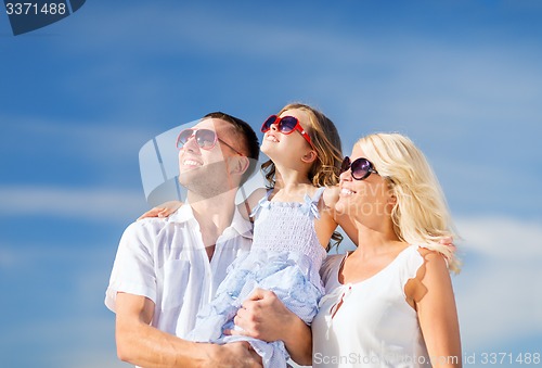Image of happy family with blue sky