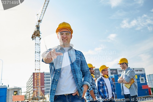 Image of builders pointing finger at you on construction