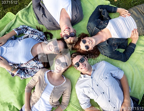 Image of group of students or teenagers lying in circle