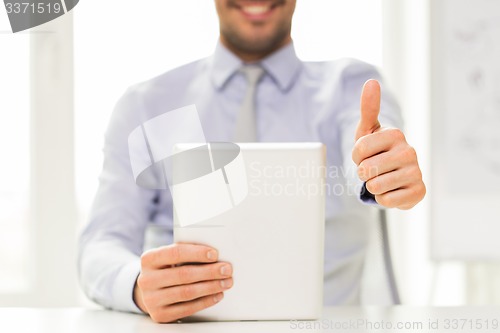 Image of close up of businessman hands with tablet pc
