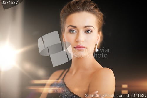 Image of woman with diamond earrings