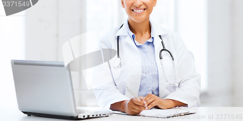 Image of female doctor with laptop pc