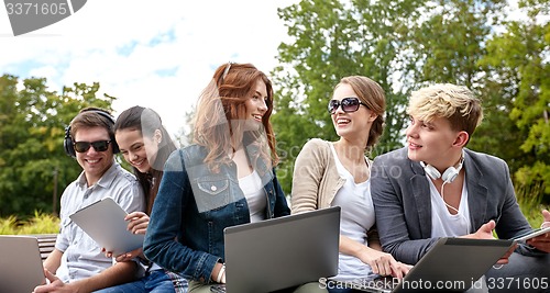 Image of students or teenagers with laptop computers