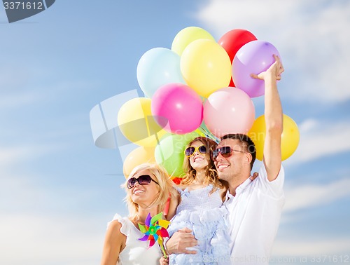 Image of family with colorful balloons