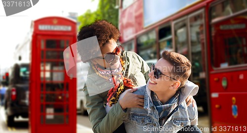 Image of happy teenage couple having fun in london city