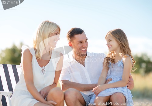 Image of happy family having a picnic