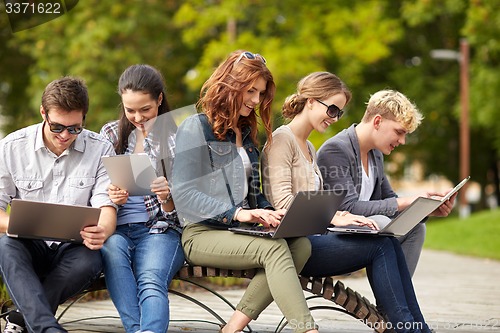 Image of students or teenagers with laptop computers