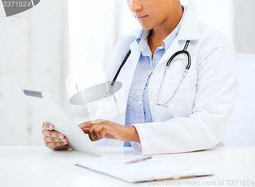 Image of african female doctor with tablet pc