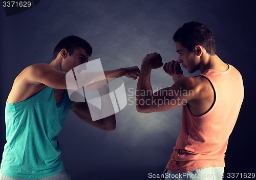 Image of young men wrestling