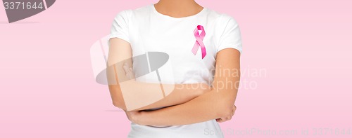 Image of smiling woman with pink cancer awareness ribbon