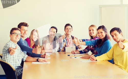 Image of group of smiling students with hand on top