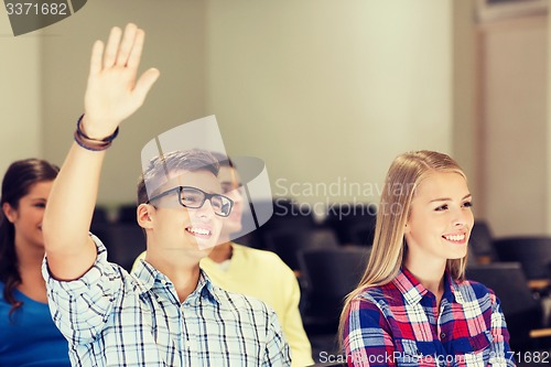 Image of group of smiling students in lecture hall