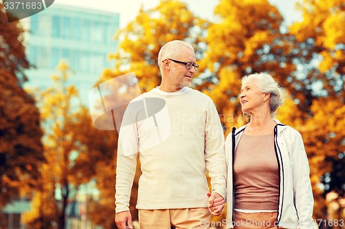 Image of senior couple in city park