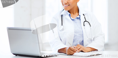 Image of female doctor with laptop pc