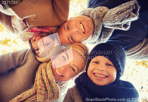 Image of happy family in autumn park