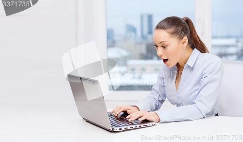 Image of surprised businesswoman with laptop