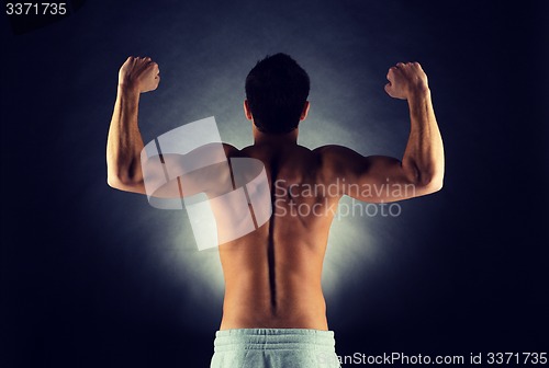 Image of young male bodybuilder from back