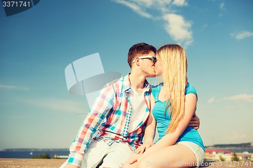 Image of smiling couple outdoors