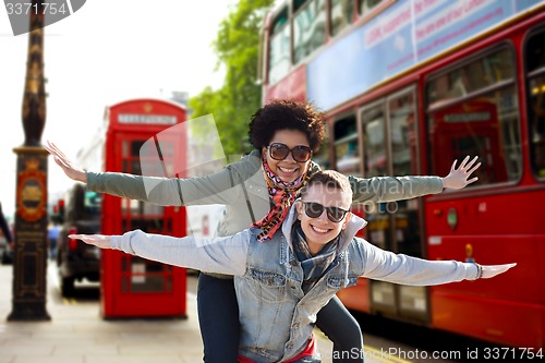 Image of happy teenage couple having fun in london city