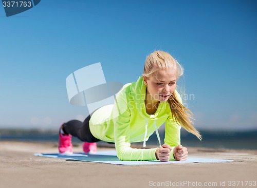 Image of woman doing sports outdoors