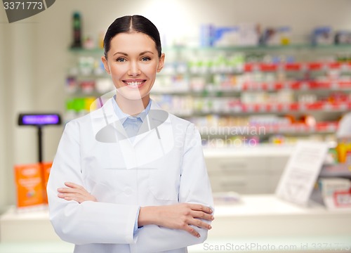 Image of young woman pharmacist drugstore or pharmacy