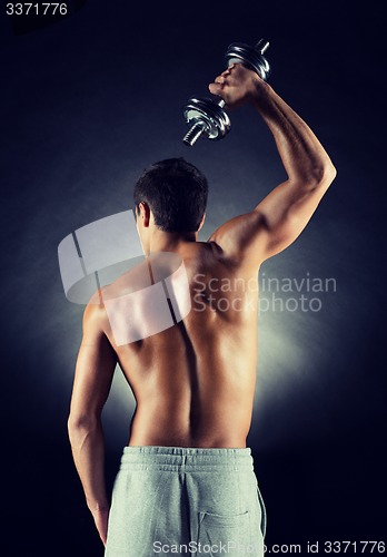 Image of young man with dumbbell