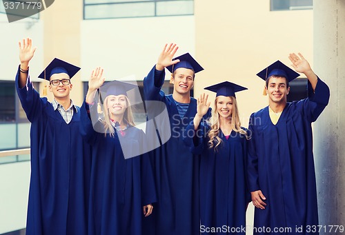 Image of group of smiling students in mortarboards