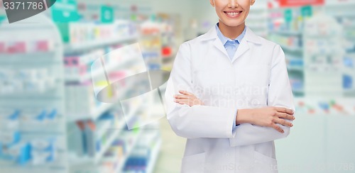 Image of young woman pharmacist drugstore or pharmacy