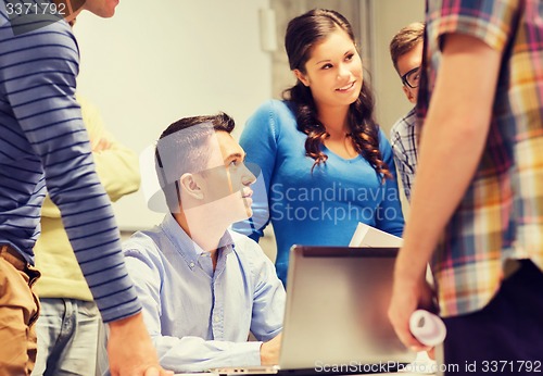 Image of group of students and teacher with laptop