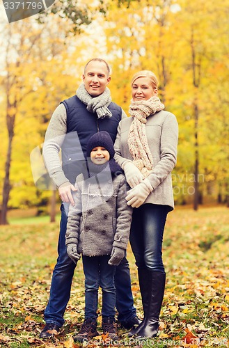 Image of happy family in autumn park