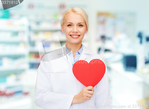 Image of woman pharmacist with heart at drugstore