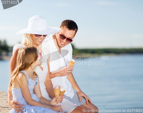 Image of happy family eating ice cream