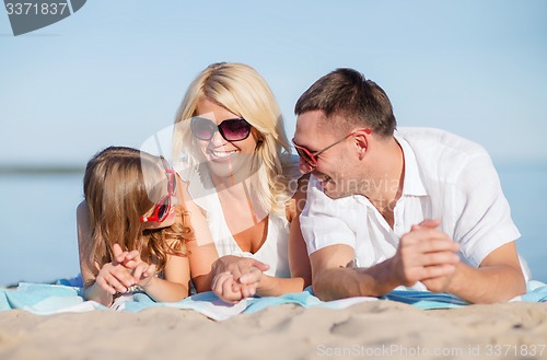 Image of happy family on the beach