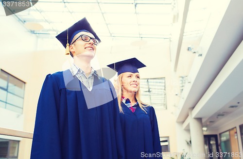 Image of group of smiling students in mortarboards