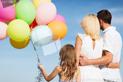 Image of family with colorful balloons