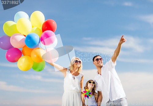 Image of family with colorful balloons