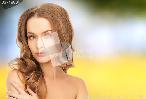 Image of beautiful young woman with bare shoulders