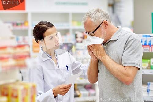 Image of pharmacist and senior man with flu at pharmacy