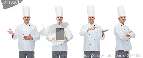 Image of happy male chef cook holding blank menu board
