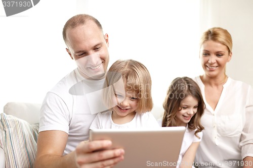 Image of happy family with tablet pc computers at home