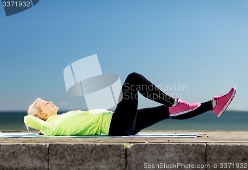 Image of woman doing sports outdoors