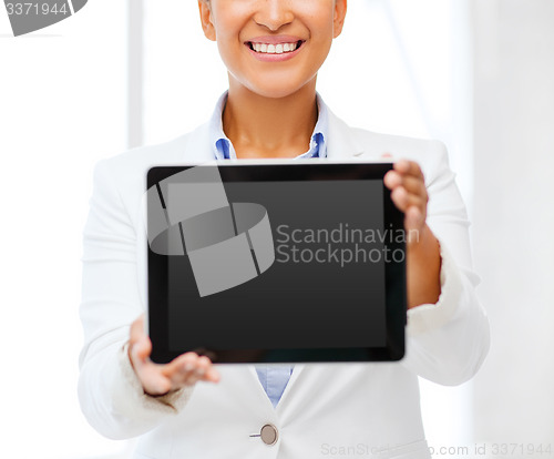 Image of businesswoman with tablet pc in office