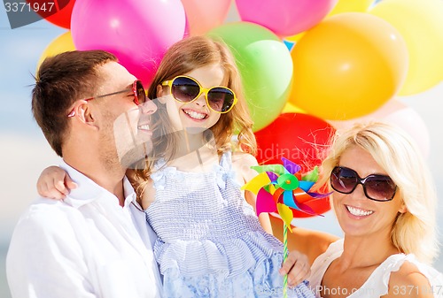 Image of family with colorful balloons