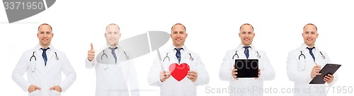 Image of doctors with red heart, tablet pc and clipboard