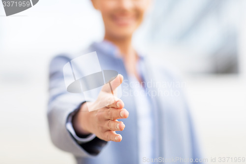 Image of close up of woman giving hand for handshake